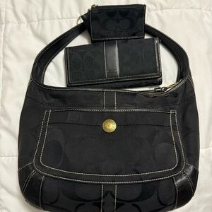 Coach Black Shoulder Bag with Curved Handle and Textured Fabric
